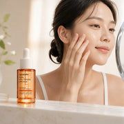 Applying Genabelle PDRN Vita Toning Ampoule to the cheek