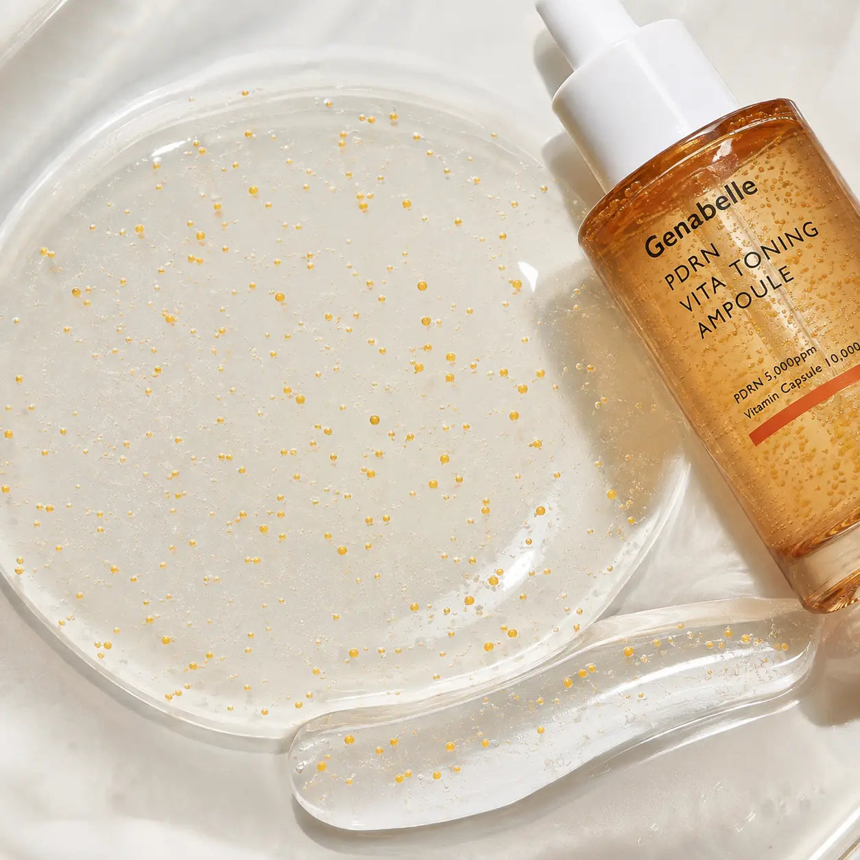 Clear gel texture and vitamin capsules in Genabelle PDRN Ampoule