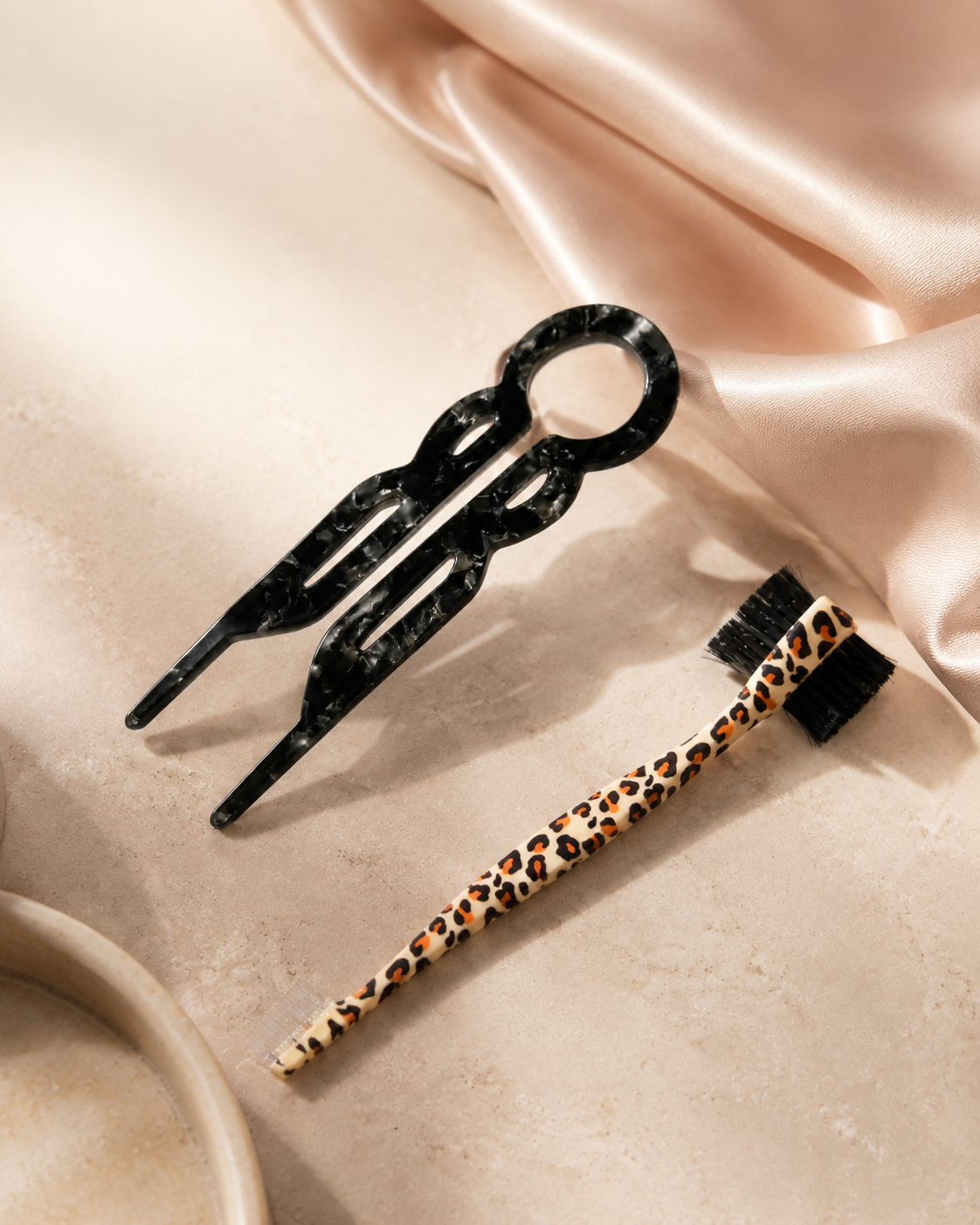Black marbled U-shaped hair pin and leopard edge brush in the Hair Prep and Finish Kit