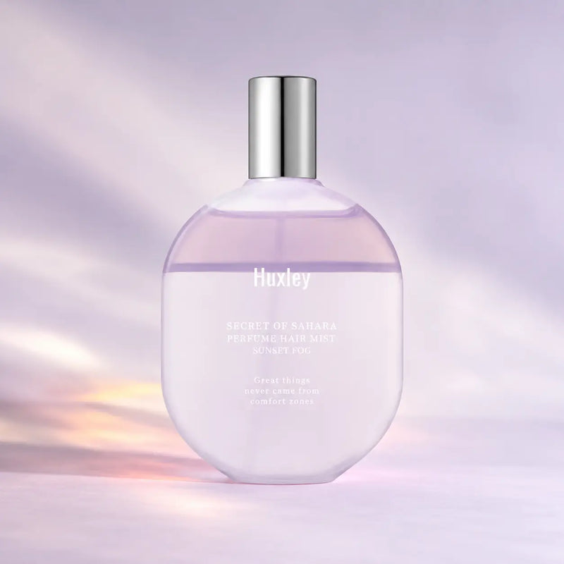 Huxley Sunset Fog perfume hair mist in its 100 g lilac bottle
