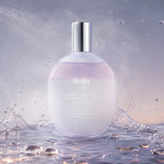 Fine dual-phase mist texture of Huxley Sunset Fog perfume hair mist