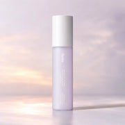 Huxley Sunset Fog hand cream mist in its slim 35 ml lilac bottle