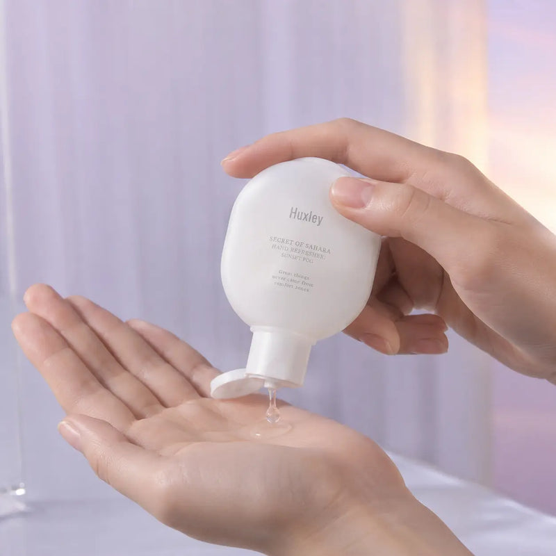 Huxley Sunset Fog hand refresher gel dispensed into dry hands