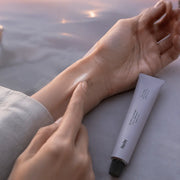 Huxley Sunset Fog solid perfume applied to the inner wrist