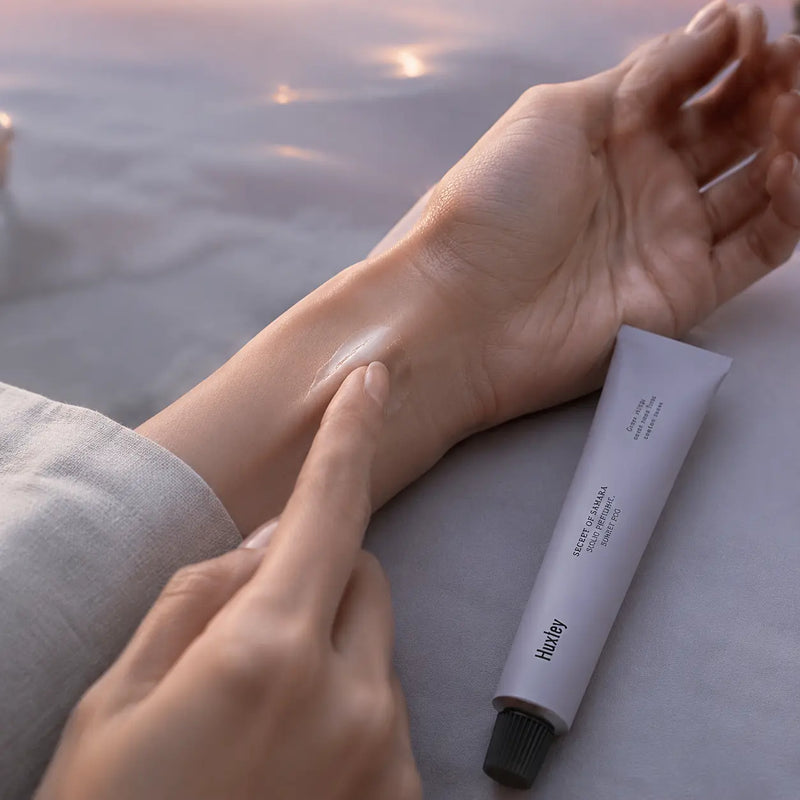 Huxley Sunset Fog solid perfume applied to the inner wrist
