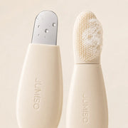 Close-up of JUMISO stainless spatula and silicone brush with cleansing foam