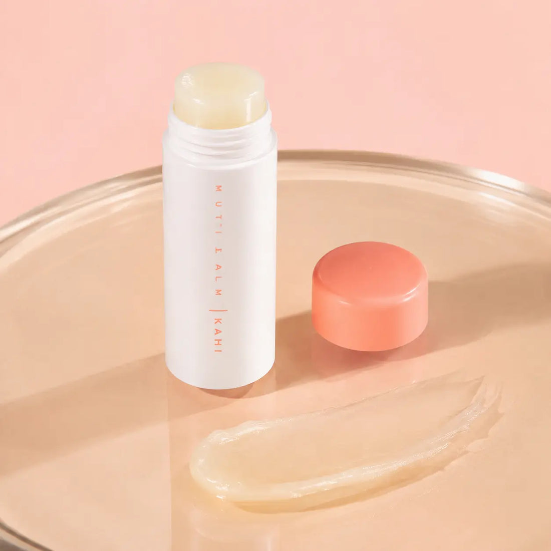 Translucent ivory solid balm with a glossy dewy finish