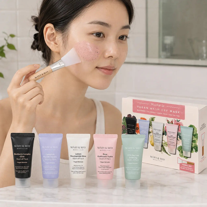 Woman applying MARY & MAY Rose Hyaluronic wash off mask with silicone brush