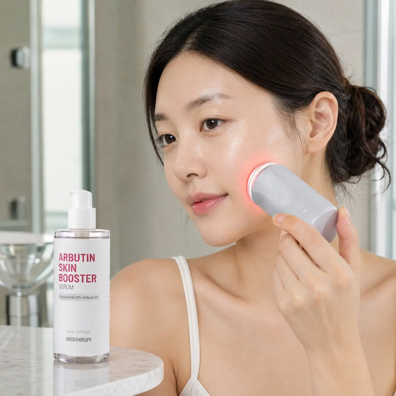 Woman gliding MEDITHERAPY Skin Booster device over serum on her cheek