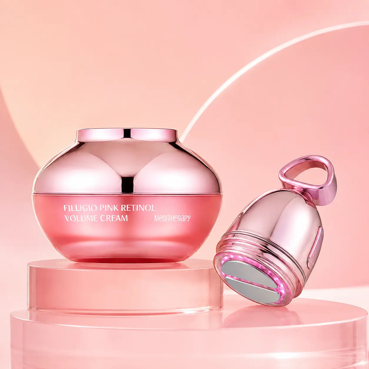 MEDITHERAPY Filligio cream and rose-gold EMS device arranged on blush acrylic