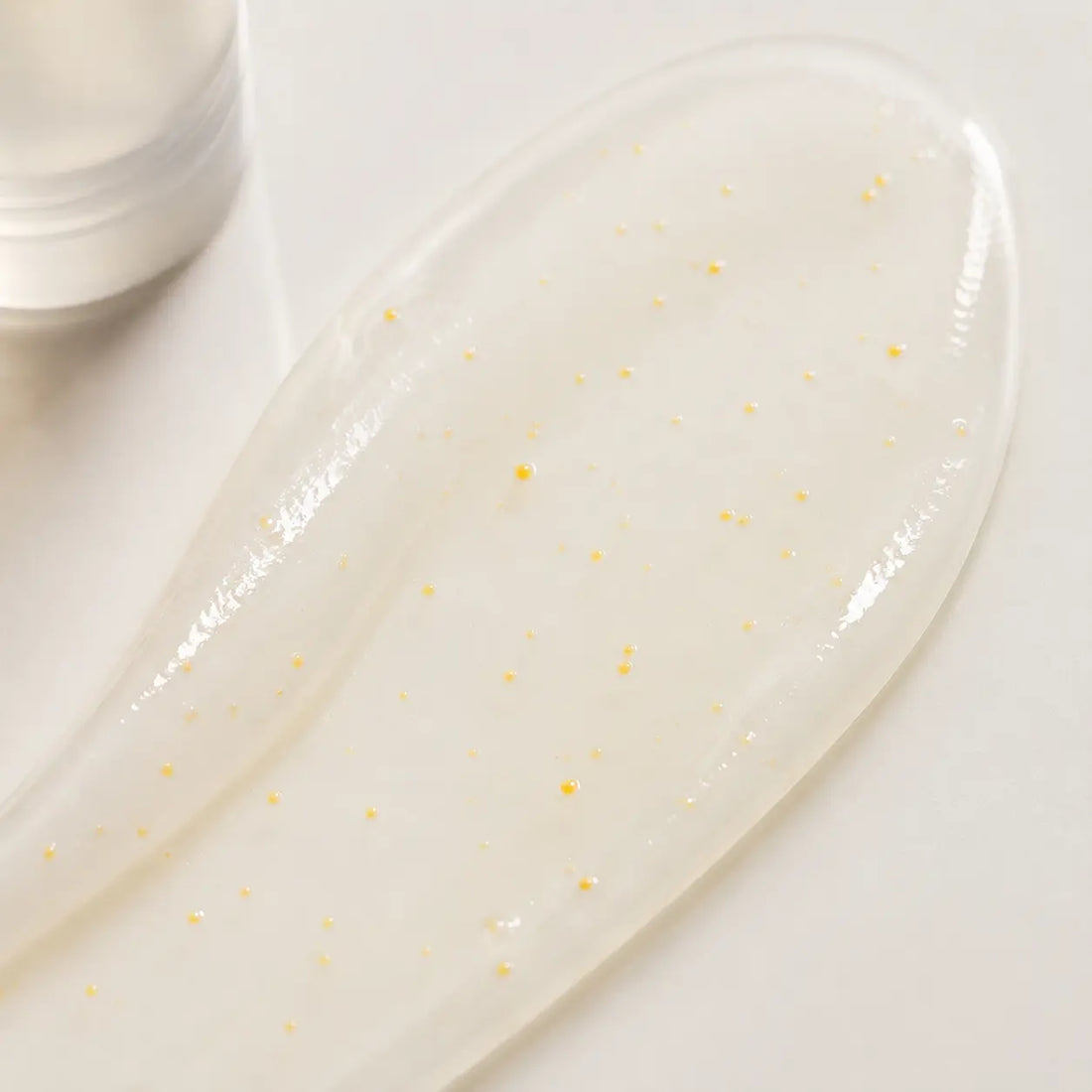 Lightweight milky water-serum with golden capsules; fresh non-heavy finish