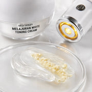 Macro view of clear Melajuran gel cream blended with pale yellow capsules