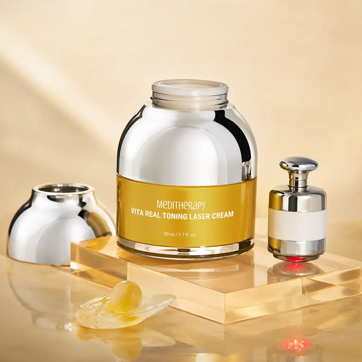 MEDITHERAPY Vita Real Toning Laser Cream jar and LED device on golden acrylic
