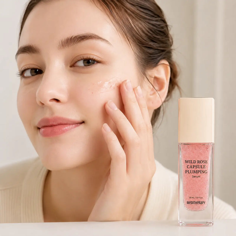 Applying MEDITHERAPY Wild Rose Capsule Plumping Serum to the cheek