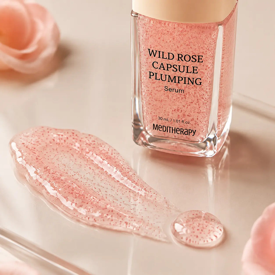 Translucent rosy water-gel with fine oil capsules and a dewy finish