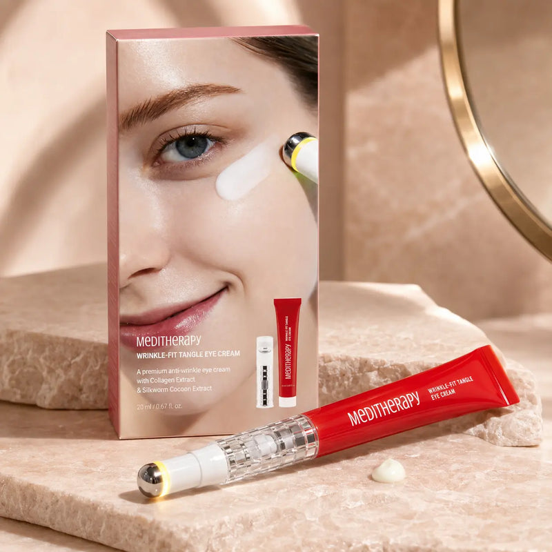 MEDITHERAPY Wrinkle-Fit eye cream and massage device on blush stone