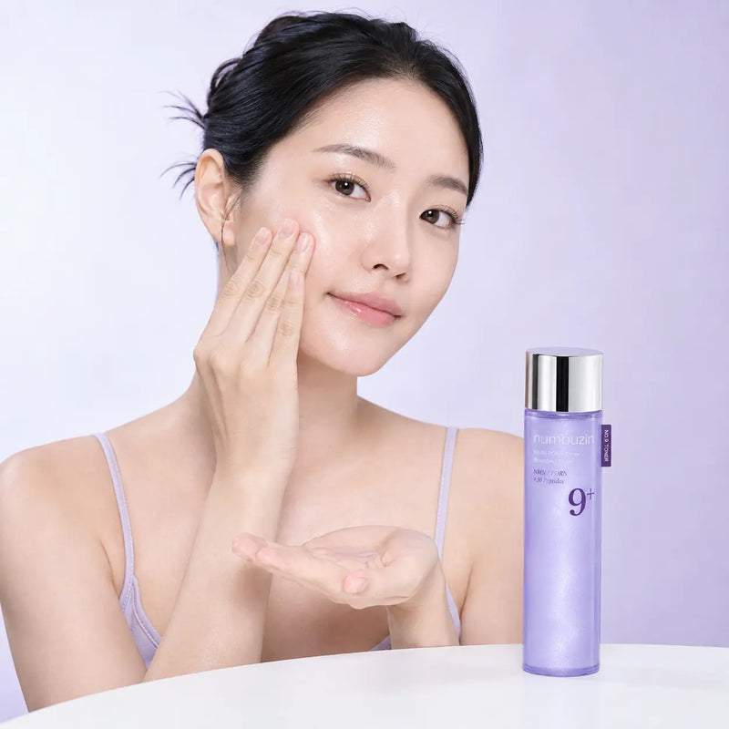 Pressing numbuzin No.9 Glow Boosting Toner into the cheek