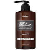 ProtoClinical k-beauty KUNDAL HONEY & MACADAMIA Natural Shampoo (Baby Powder) 1058ml single tall warm brown shampoo bottle centered on a white background with pale aqua side accents.