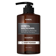 ProtoClinical k-beauty KUNDAL HONEY & MACADAMIA Natural Shampoo (Baby Powder) 500ml single tall warm brown shampoo bottle centered on a white background with pale aqua side accents.