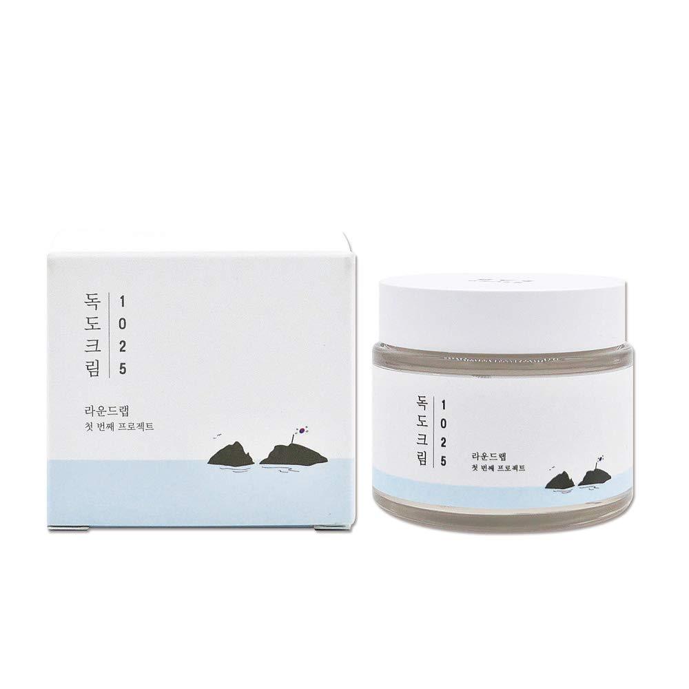 ProtoClinical k-beauty ROUND LAB 1025 DOKDO Cream 80mL abstract beauty graphic with pale blue, gray, and peach tones on a light background.