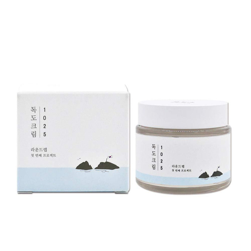ProtoClinical k-beauty ROUND LAB 1025 DOKDO Cream 80mL abstract beauty graphic with pale blue, gray, and peach tones on a light background.