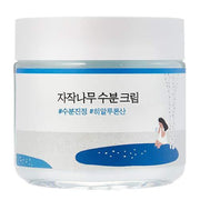 ProtoClinical k-beauty dark blue beauty product silhouette with soft pink side accents on a pale background.