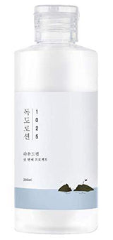 ProtoClinical k-beauty Round Lab Dokdo Lotion 200ml gray product silhouette with soft horizontal bands on a white background