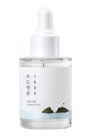 ProtoClinical k-beauty gray beauty product silhouette with soft side extensions on a white background.