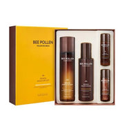 ProtoClinical k-beauty MISSHA Bee Pollen Renew Skincare Set multiple golden bottles with a blue bottle at the right on a pale background
