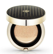 ProtoClinical k-beauty CNP Propolis Ampule In Cushion 15g + 15g Refill Set round makeup compact in warm beige and brown tones on a light background