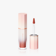 ProtoClinical k-beauty [DEAR DAHLIA] BLOOMING EDITION Petal Touch Plumping Lip Velour 3.8g #Tickle shown as a slim coral lip product silhouette on a clean white background with soft blue side tones