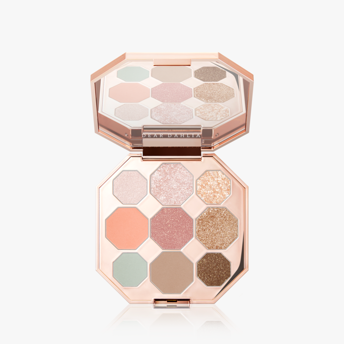 ProtoClinical k-beauty beauty close-up on a pale background in soft dawn-toned neutrals.