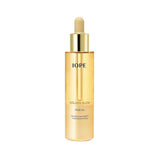 ProtoClinical k-beauty gold beauty product centered between pale aqua side panels.