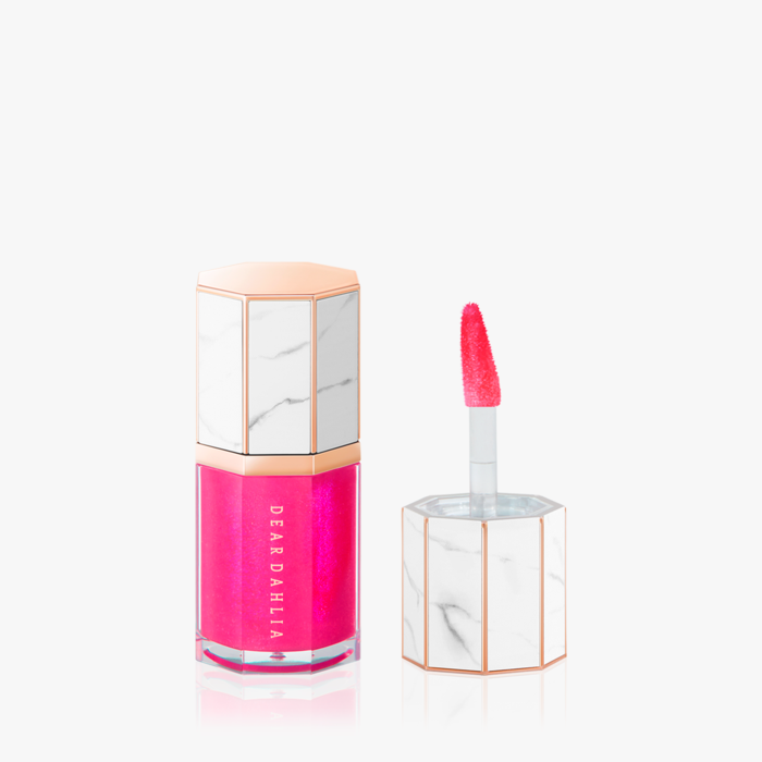 ProtoClinical k-beauty soft plum beauty close-up with a centered teardrop-shaped form on a pale background.