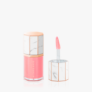 ProtoClinical k-beauty [DEAR DAHLIA] Paradise Aurora Shine Lip Treatment 6.5ml #02 Star Dust close-up with a centered vertical form on a pale background in soft dusty rose tones