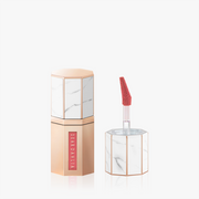 ProtoClinical k-beauty soft beige and muted rose beauty close-up with a centered vertical form on a pale background.