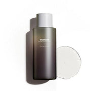 ProtoClinical k-beauty charcoal beauty product silhouette with soft gray side panels on a light background.