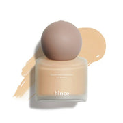 ProtoClinical k-beauty warm beige beauty product silhouette with a soft brown center on a light background.
