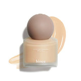 ProtoClinical k-beauty warm beige beauty product silhouette with a soft brown center on a light background.