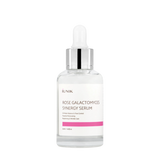 ProtoClinical k-beauty iUNIK Rose Galactomyces Synergy Serum 50ml clear glass serum bottle with pink text, pink accents, and a dropper cap on a light background