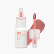 ProtoClinical k-beauty peripera Ink Airy Velvet 4g (NEW #35~#39) two upright lip tint package silhouettes with a slim peach tube beside a taller brown rectangular box on a pale blue and white background