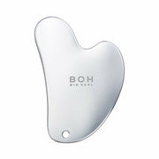 ProtoClinical k-beauty gray beauty product centered between pale blue side panels.