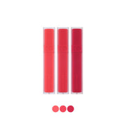 ProtoClinical k-beauty rom&nd Blur Fudge Tint (11 Colors) as a single rose lip tint tube centered upright on a pale background with soft aqua side accents