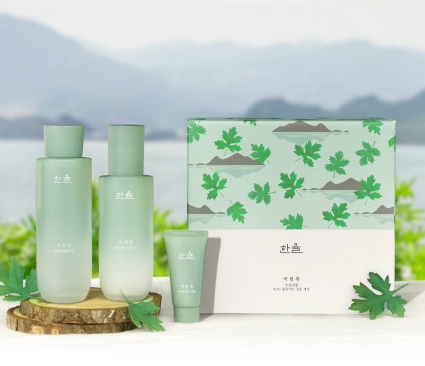 ProtoClinical k-beauty HANYUL Pure Artemisia Calming Balancing Set with multiple green skincare bottles and matching boxes arranged on a soft green background