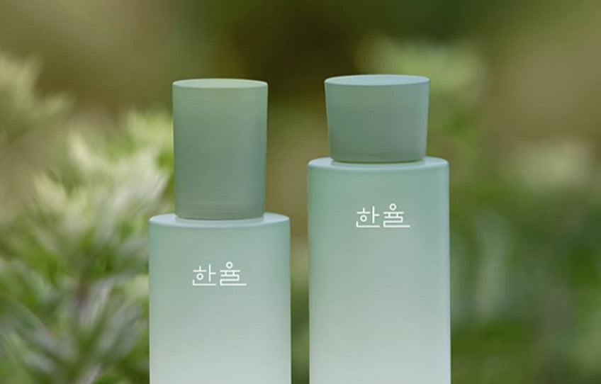 ProtoClinical k-beauty HANYUL Pure Artemisia Calming Balancing Set with multiple green skincare bottles and matching boxes arranged on a muted green background