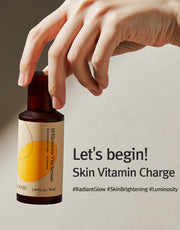 ProtoClinical k-beauty 12GRABS: 10 Elements Vita Serum (50ml) amber bottle held upright by a hand with bold black headline text on a beige background