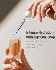 ProtoClinical k-beauty 12GRABS: Octuple Hyaluron Moist Essence (50ml) open dropper bottle held in two hands with a lifted glass pipette and bold black headline text on a beige background