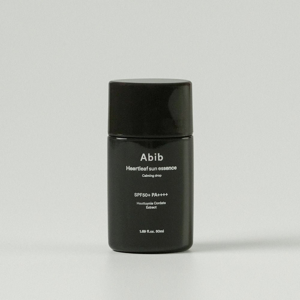 ProtoClinical k-beauty Abib Heartleaf sun essence Calming drop 50ml (SPF50+ PA++++) single upright dark sun essence package centered on a light background.