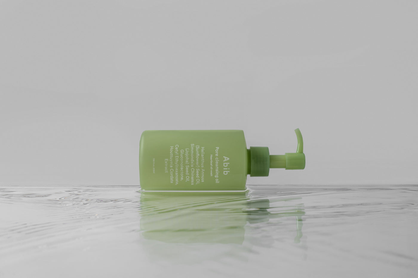 ProtoClinical k-beauty muted olive green beauty graphic with pale gray edges on a light background.
