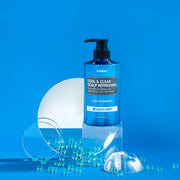 ProtoClinical k-beauty KUNDAL COOL&CLEAR SCALP REFRESHING Pure Natural Balancing Refreshing Cool Shampoo 500ml #AQUA MINT single upright deep blue shampoo bottle centered on a light blue background.